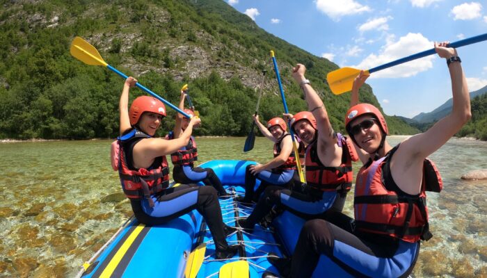 Friends enjoying a private rafting tour in the Soča Valley, Slovenia